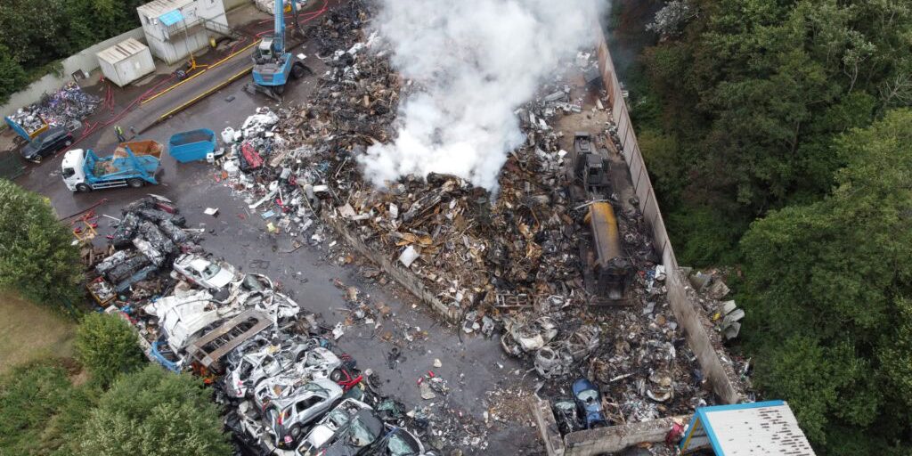 Practical Environmental Compliance at UK Waste Facility – AC Environmental Why Practical Compliance Matters - Environmental consultant reviewing a fire prevention plan at a UK waste site