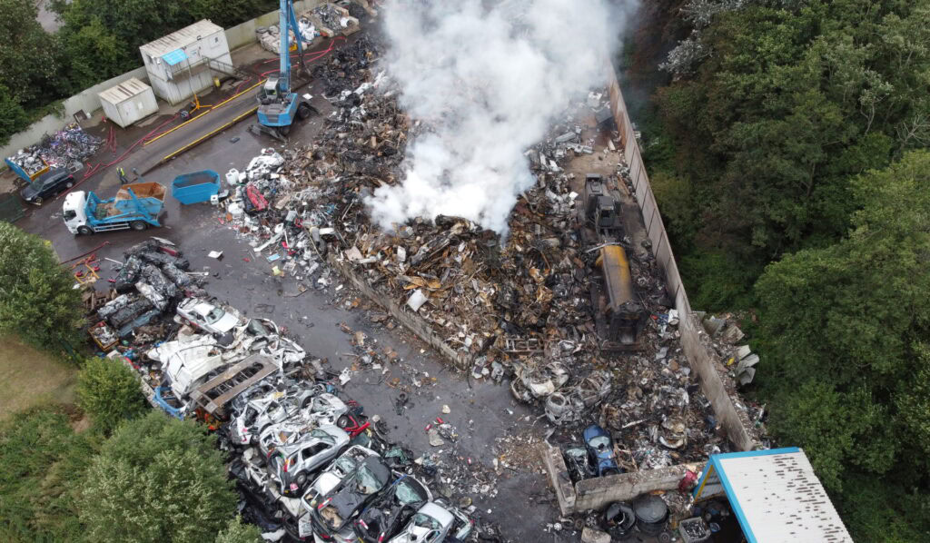 Practical Environmental Compliance at UK Waste Facility – AC Environmental Why Practical Compliance Matters - Environmental consultant reviewing a fire prevention plan at a UK waste site